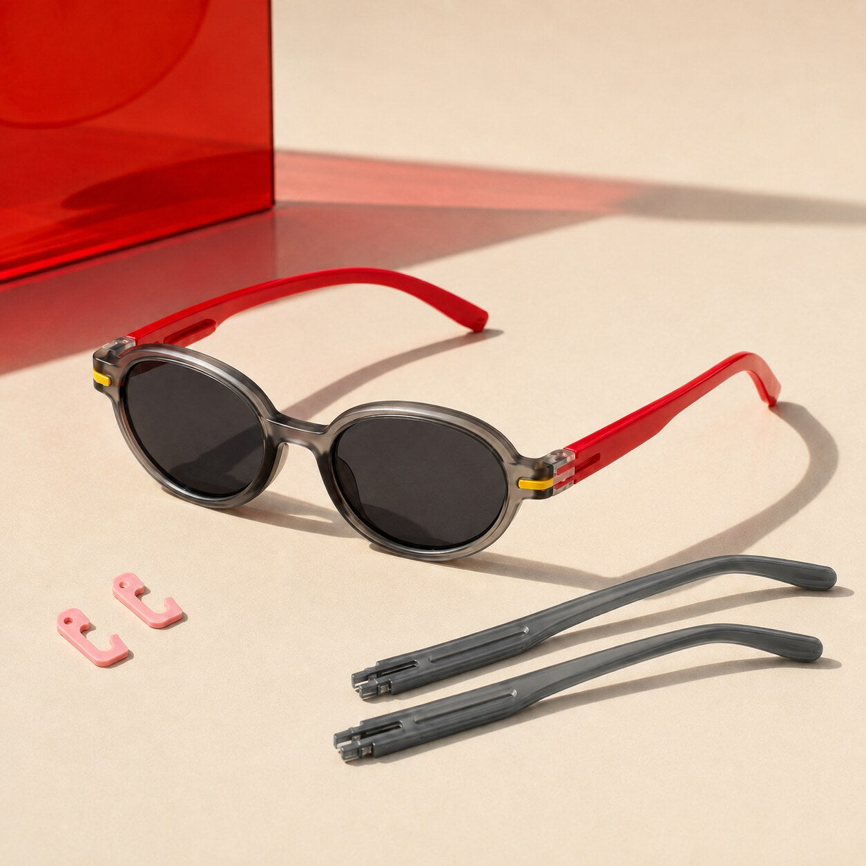 Black lens sunglasses with Signal Red temples and included Daily Gray temples